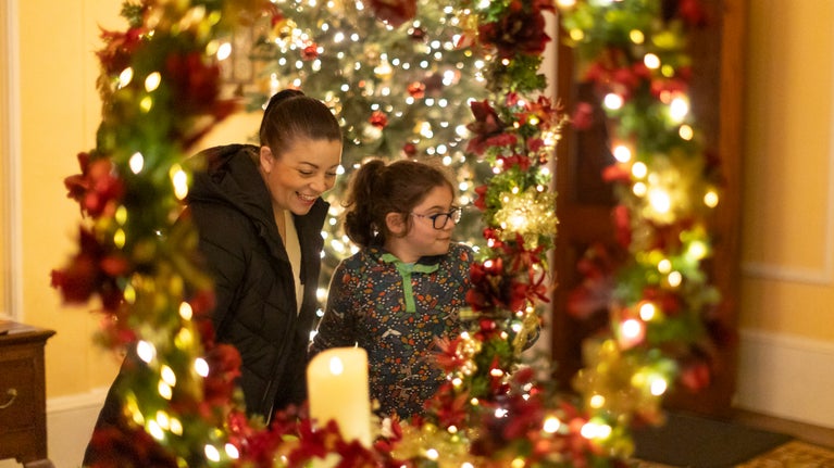 Two visitors admire the decorations at Trelissick house